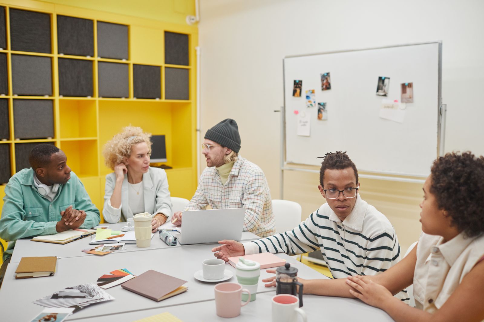 A creative team discussing ideas around a table